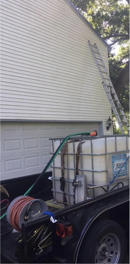 Vinyl siding and garage door clean and white after house washing